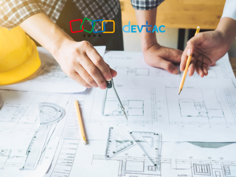 Two people sketching architectural blueprints on a table with drafting tools; a yellow hard hat sits nearby. Logos for Zoho and DEVTAC are overlaid at the top center.