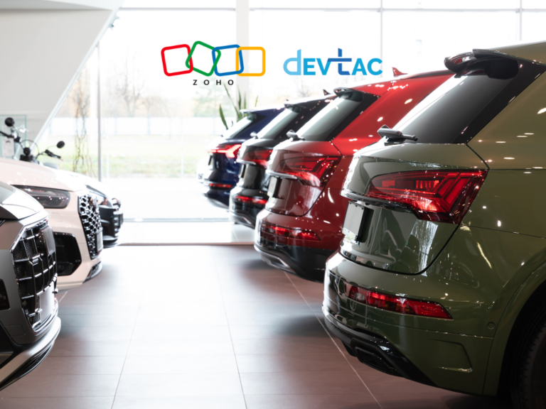 Showroom of multiple cars lined up in a dealership, with Zoho and DevTac logos floating above