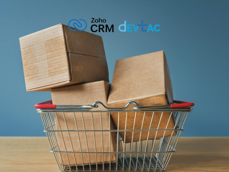 A metal shopping basket filled with stacked cardboard boxes, set against a blue background with Zoho CRM and Devtac logos.