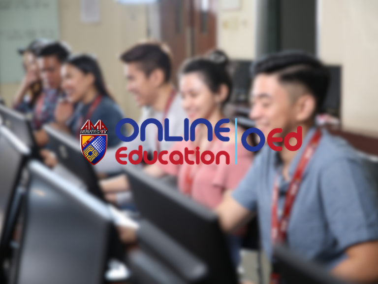 Blurry classroom or computer lab with students sitting at desks using laptops. A large, colorful logo overlays the center: ‘online oed’ in blue and red with the word ‘Education’ underneath in a lighter red, and a small shield/crest with the text ‘AMA University’ on the left. The scene suggests an online education brand or program.