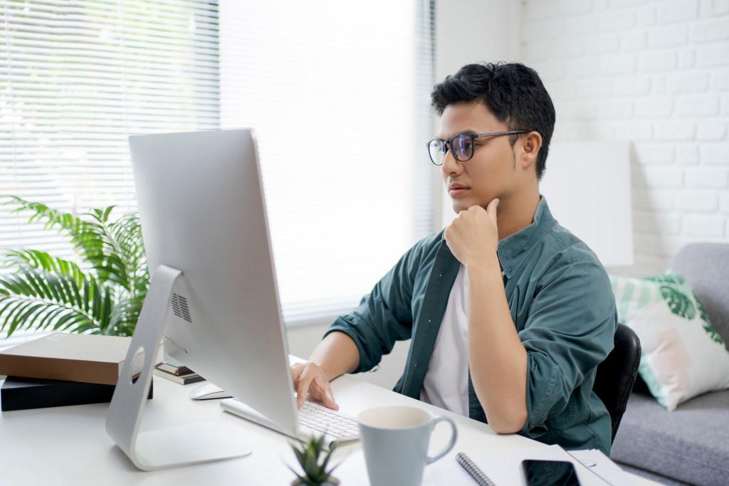 11 Ways on How to Manage Remote Teams male young professional working at home