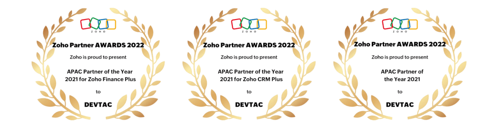 Three gold laurel award seals, each topped with a colorful ZOHO logo and dark center text.