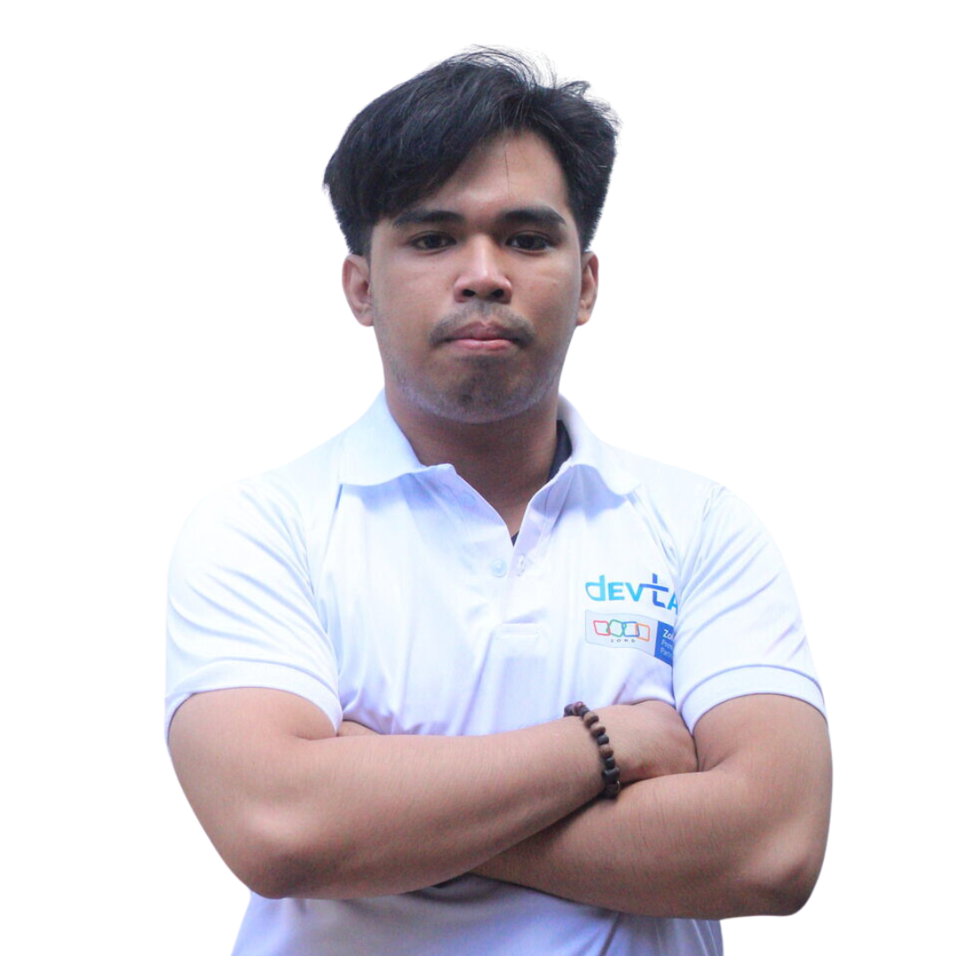 Devtac Team Portrait of a man in a white polo shirt with DevTac logo, standing against a plain background