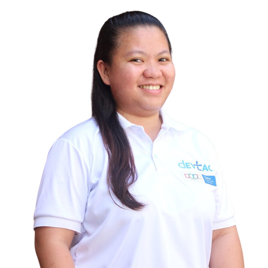 Devtac Team Portrait of a woman in a white polo shirt with DevTac logo, standing against a plain background