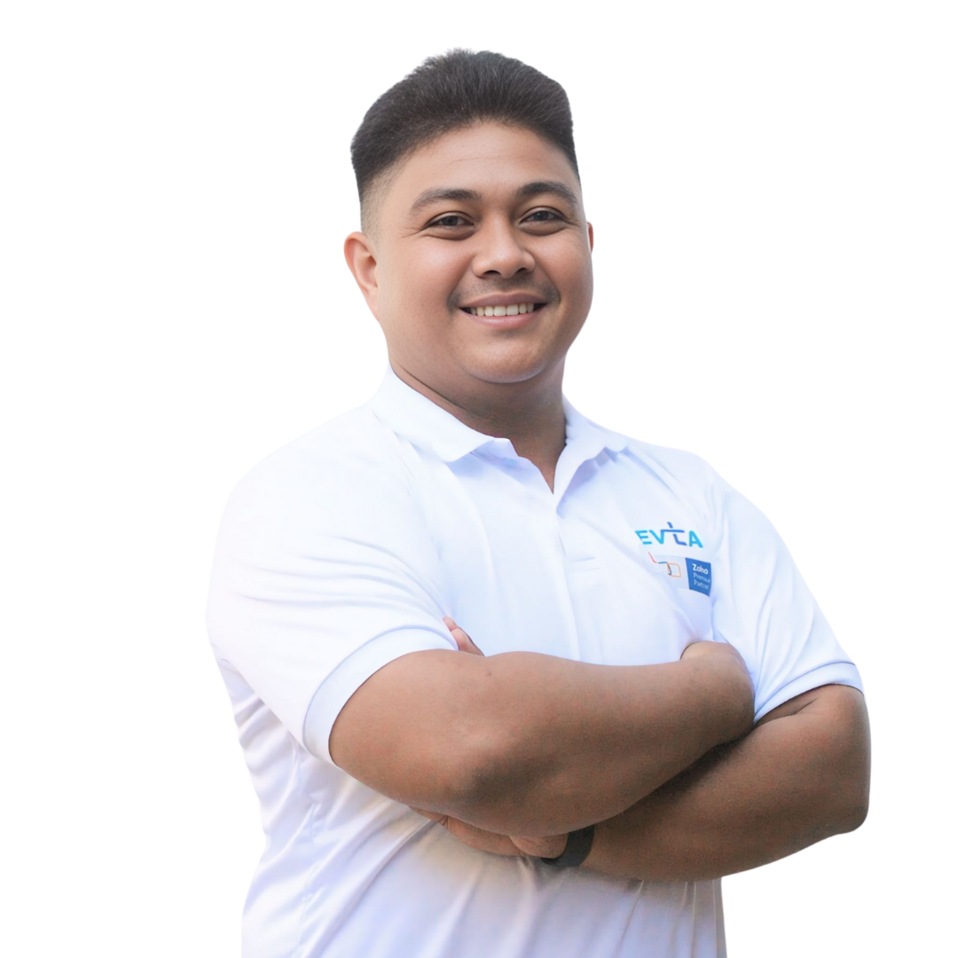 Devtac Team Portrait of a man in a white polo shirt with DevTac logo, standing against a plain background