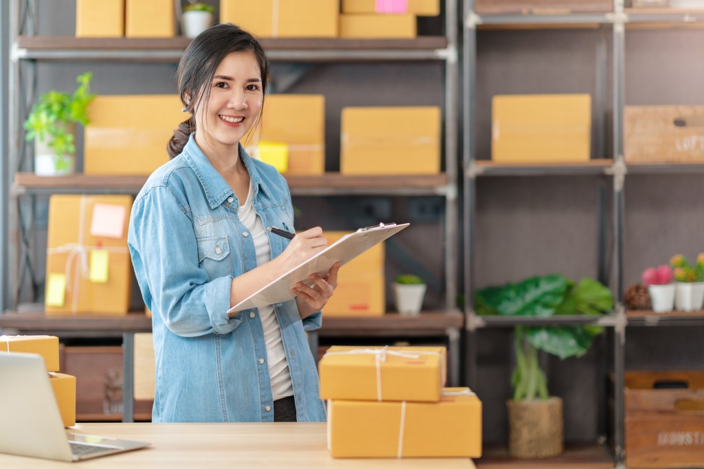 a female entrepreneur checking all her orders