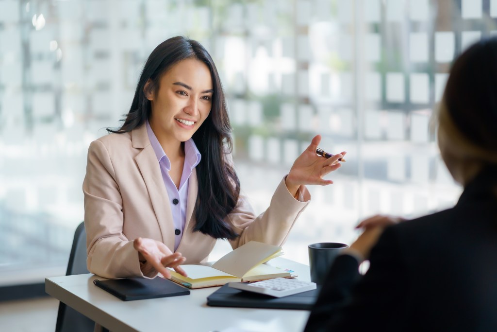 a young professional talking to a client