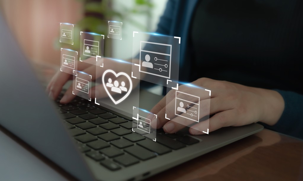 Importance of Customer Relationship Management for Boosting Business Growth a person using a laptop with profile icons in front