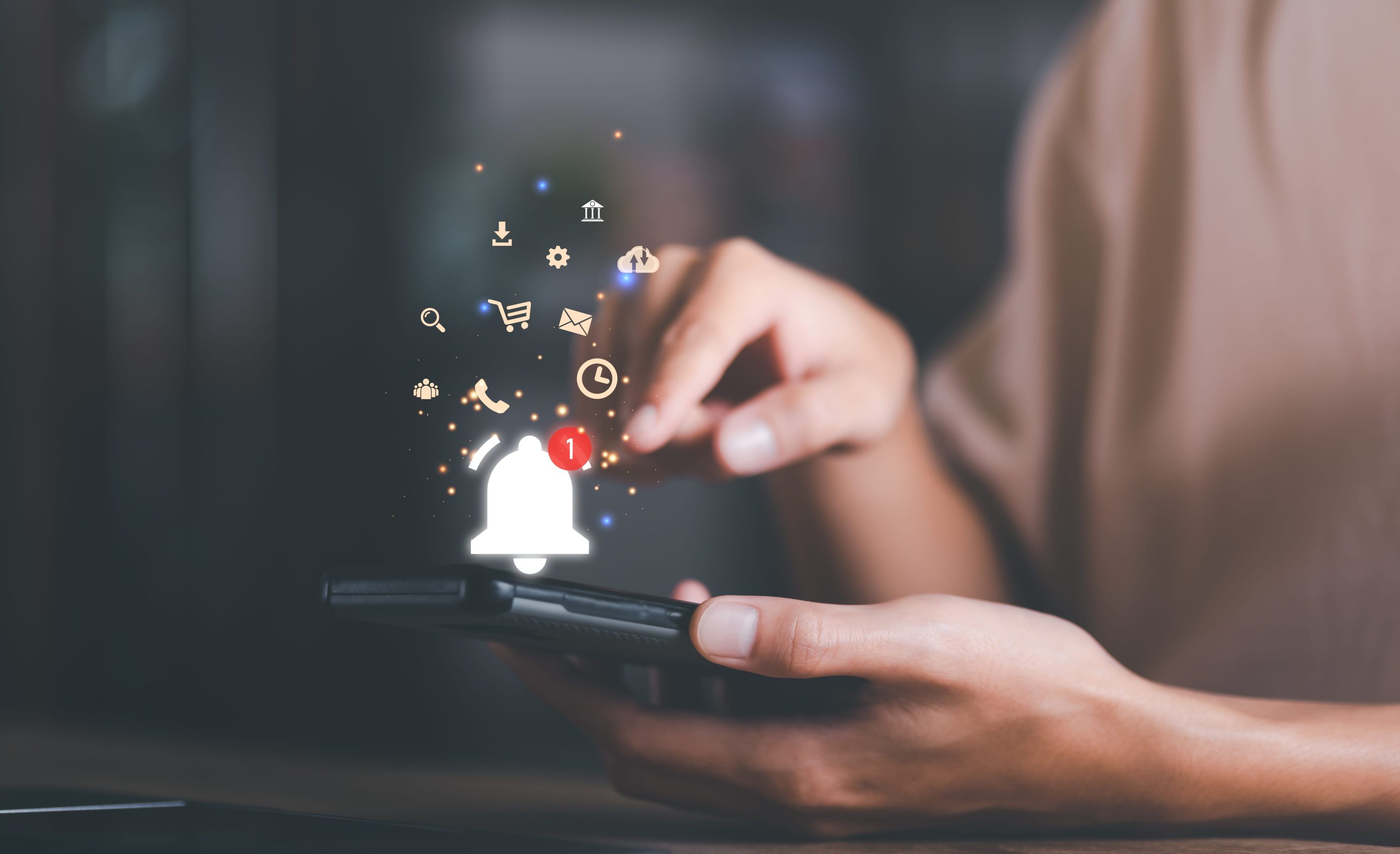 the smartphone and the bell icon show notifications of new messages and applications