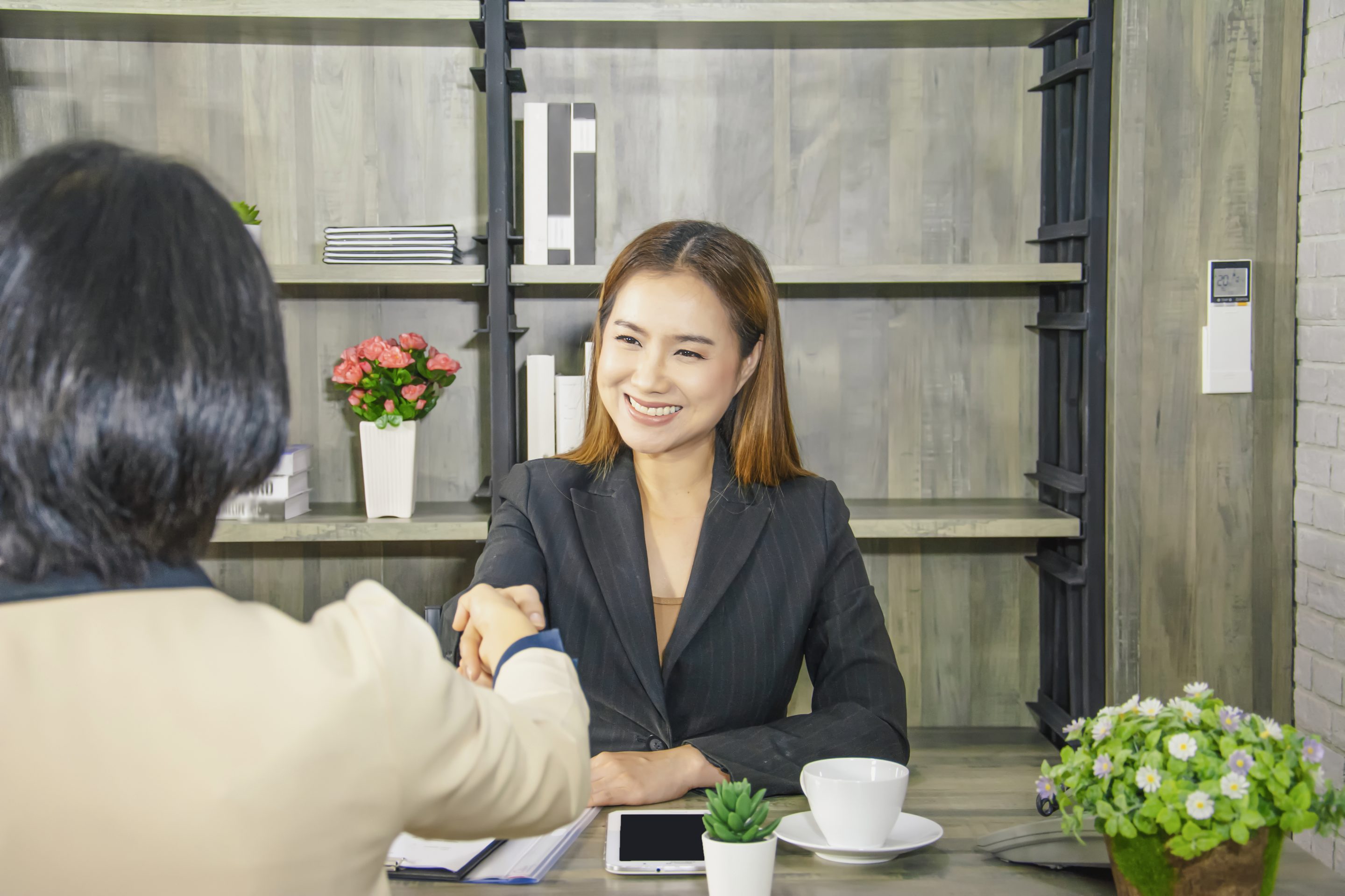 a recruiter holding hand with a candidate