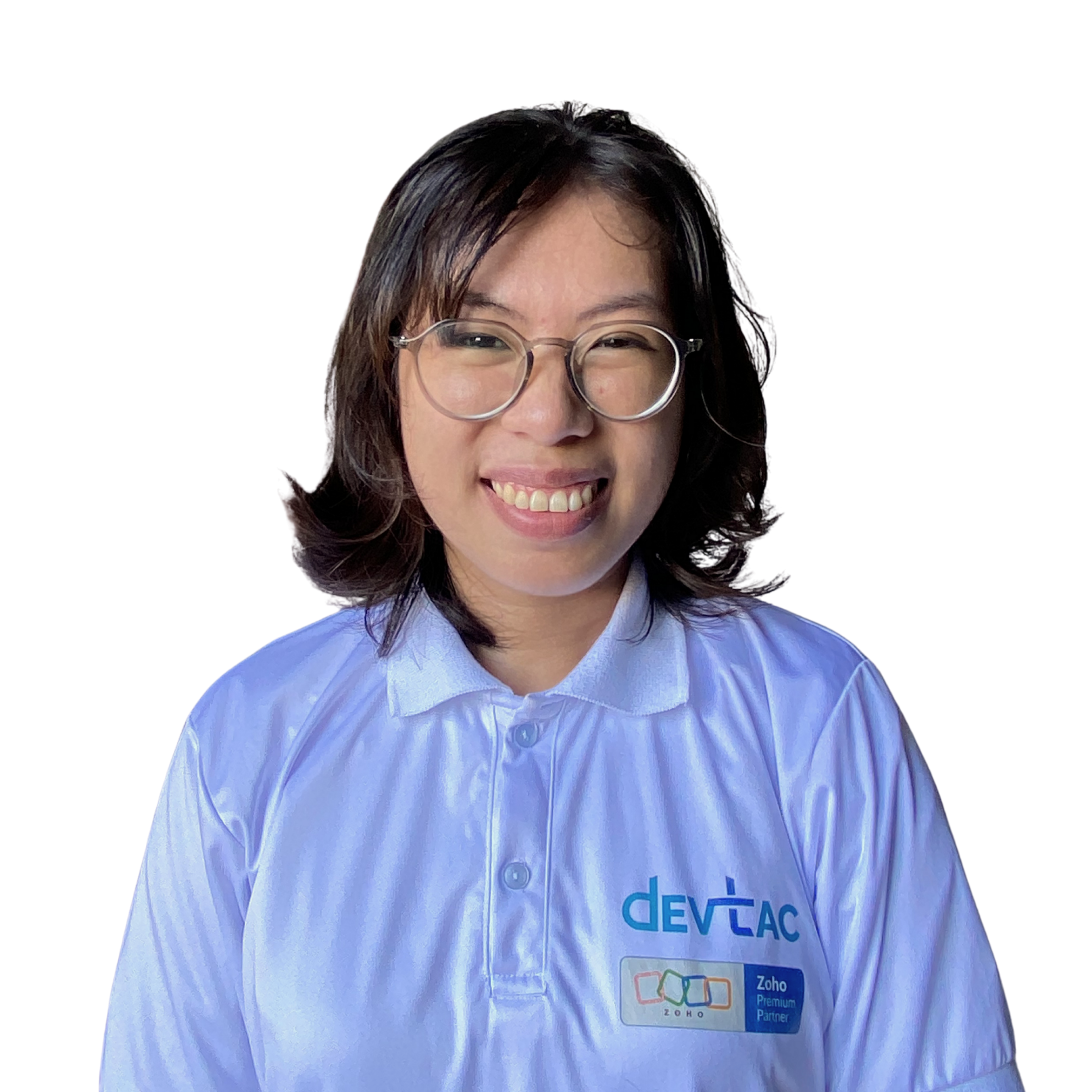 Portrait of a woman in a white polo shirt with DevTac logo, standing against a plain background
